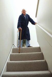 Senior man walking down stairs