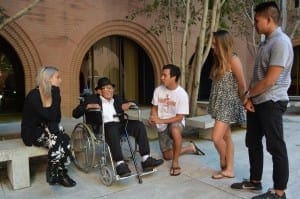 Gonzales chats with gerontology undergraduates in the Andrus Center courtyard.