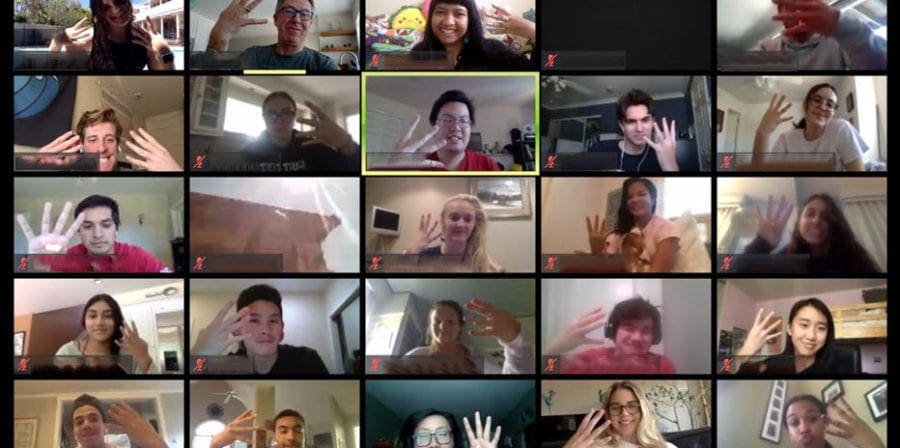 Zoom screenshot of Walsh’s students holding up four fingers to represent their course, Gero 414, Neurobiology of Aging.
