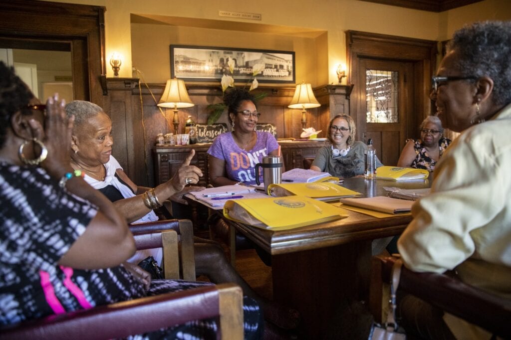 Women talk about their caregiving experiences at a support group meeting last year at First AME church’s Allen House in Los Angeles. The pandemic has forced the group to meet by conference call (Brian van der Brug/Los Angeles Times).