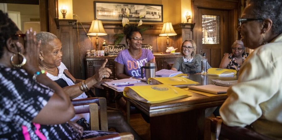 Women talk about their caregiving experiences at a support group meeting last year at First AME church’s Allen House in Los Angeles. The pandemic has forced the group to meet by conference call (Brian van der Brug/Los Angeles Times).