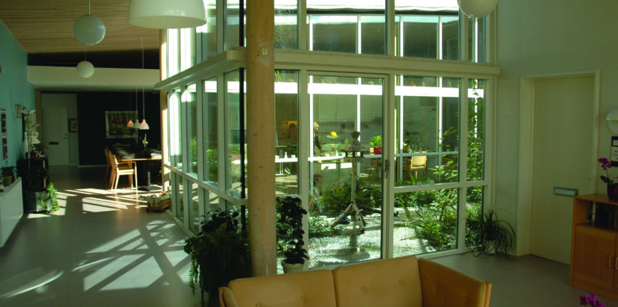 Ærtebjerghaven, a senior living community in Odense, Denmark, includes health-promoting design features, including decentralized residential clusters; atriums that provide light, fresh air and safe outdoor access; single-occupancy rooms with private bathrooms; and large, open common spaces that can be reconfigured for physical distancing (photo: Victor Regnier).