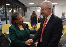 Cheryl Brown greets Pinchas Cohen, dean of the USC Leonard Davis School of Gerontology. (Photo/Beth Newcomb)