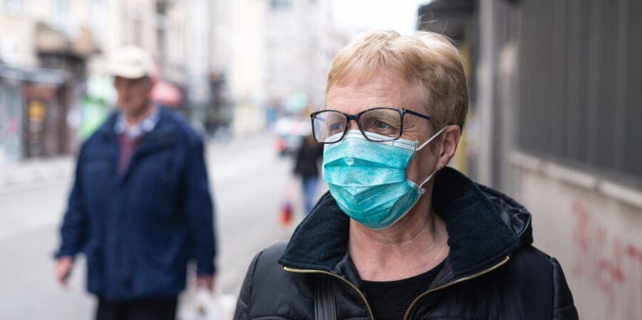 Senior woman wearing mask to protect from Coronavirus