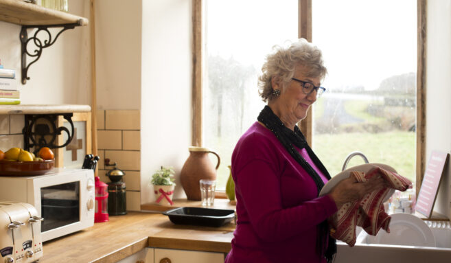 older woman at home in kitchen