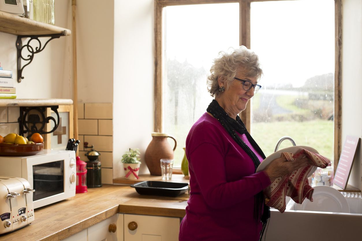 older woman at home in kitchen