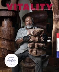 Cover of Vitality Magazine Fall 2022 with Thad Mosley holding his wooden art sculpture