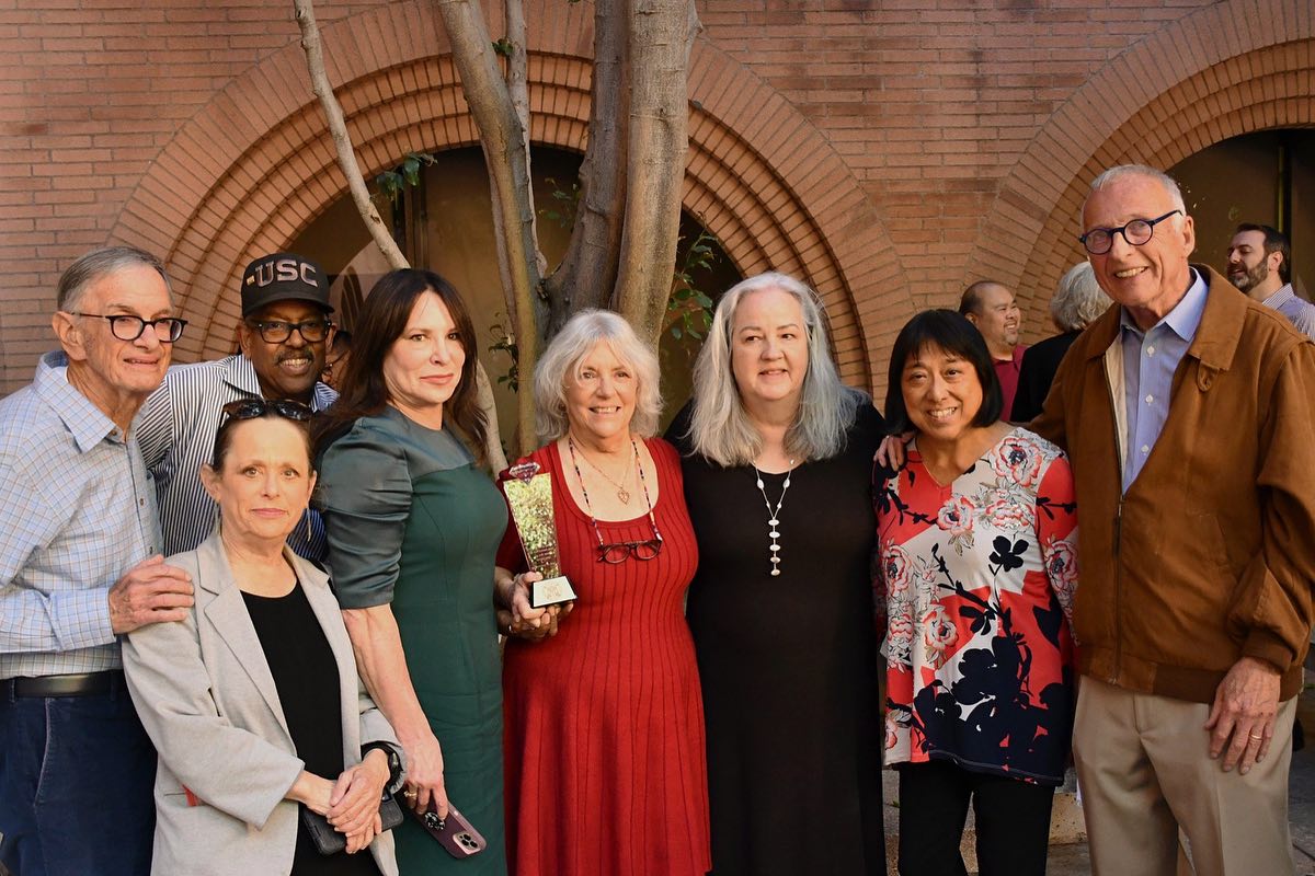 Linda Broder, faculty, and guests at her retirement event