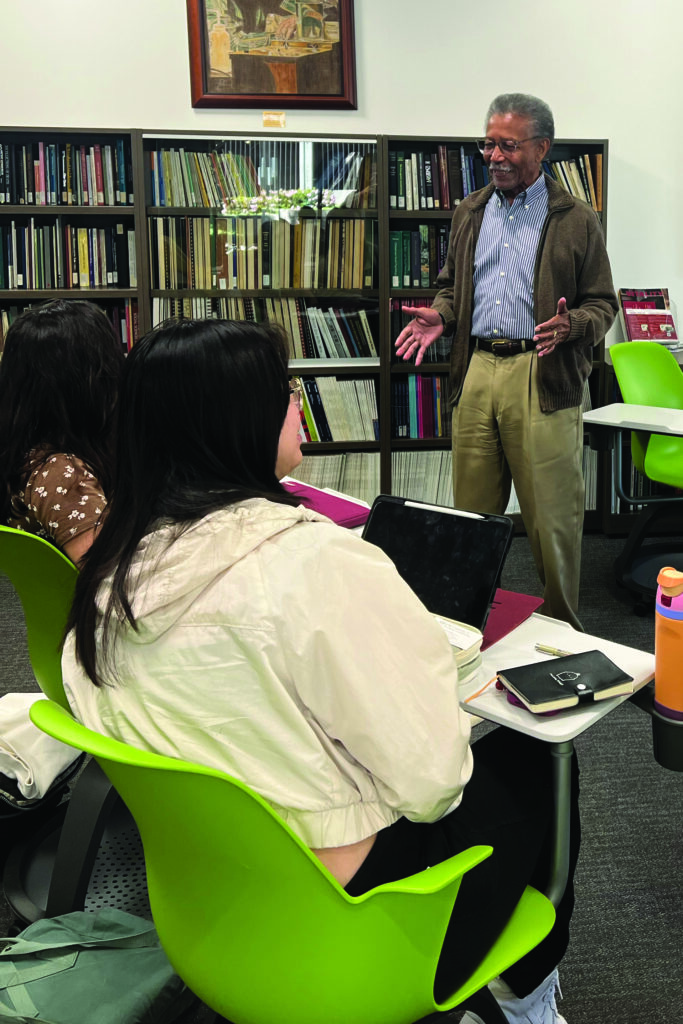 Retired dentist and Andrus volunteer Warren Blakely speaks to students about his professional and personal experiences.